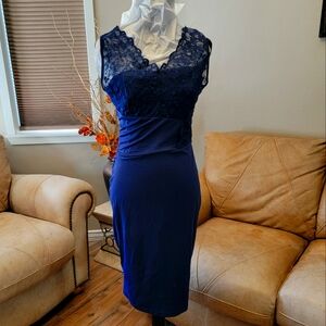 Sleeveless navy, knee length dress.